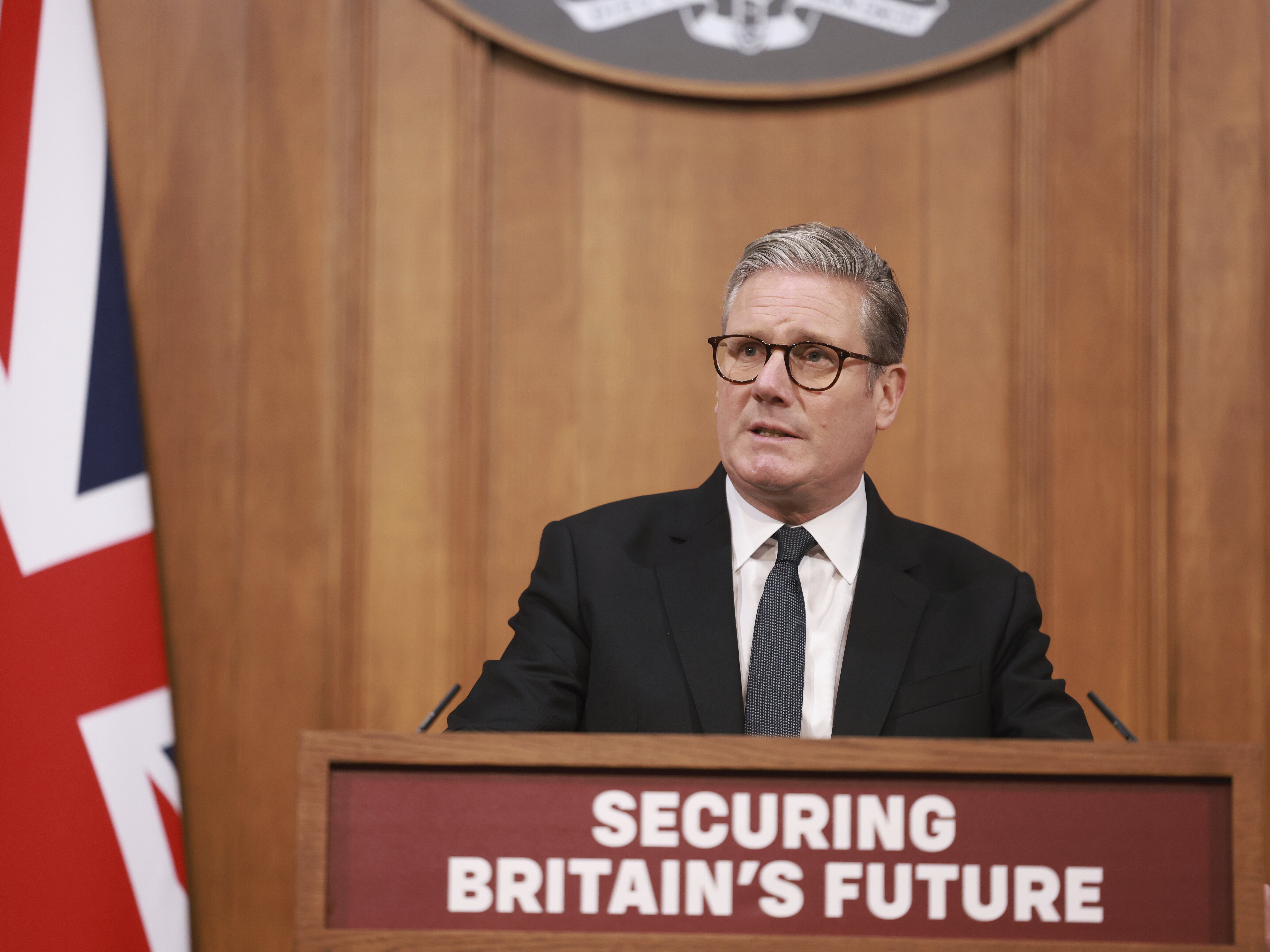 caption: British Prime Minister Keir Starmer speaks during a news conference, ahead of the publication of the government's immigration policy paper, in London, Monday.