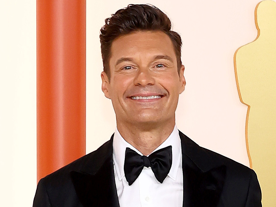 caption: Ryan Seacrest will become the host of the famous <em>Wheel of Fortune</em> game show in 2024. He's seen here at this year's Academy Awards in Hollywood.