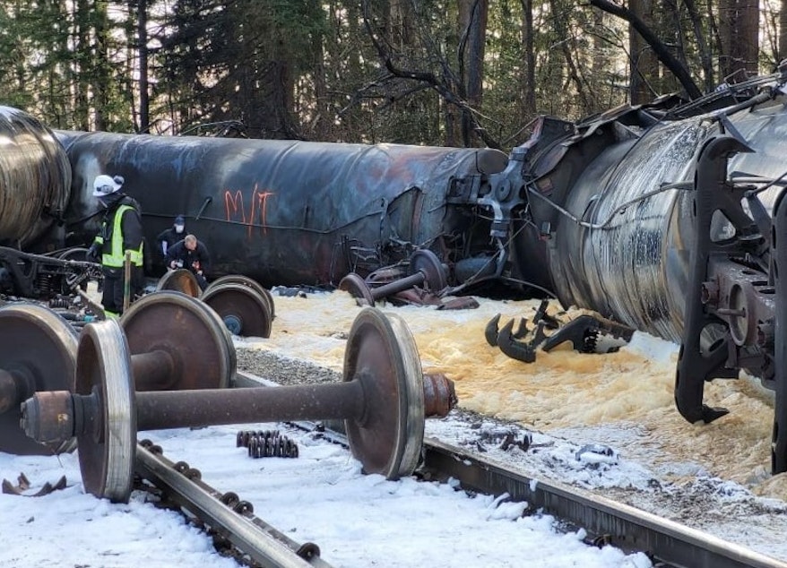caption: Officials inspect the aftermath of an oil train fire in Custer, Washington, on Dec. 24.
