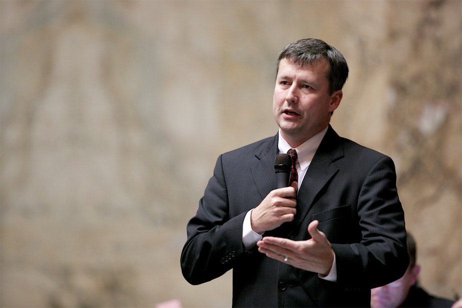 caption: In this file photo, former state Rep. Matt Manweller speaks on the floor of the Washington state House.