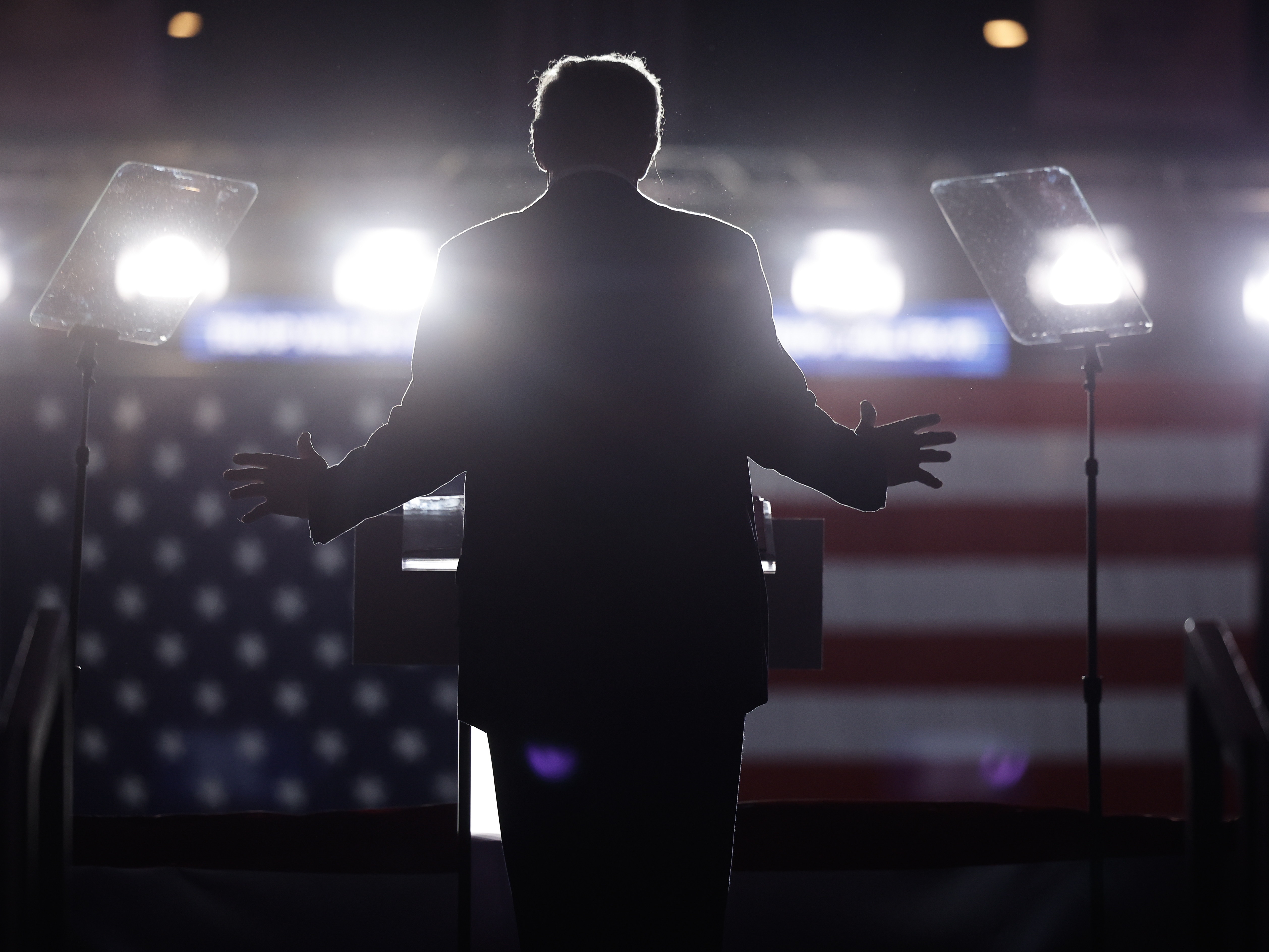 caption: Former President Donald Trump holds a campaign rally at the Santander Arena in Reading, Pa.