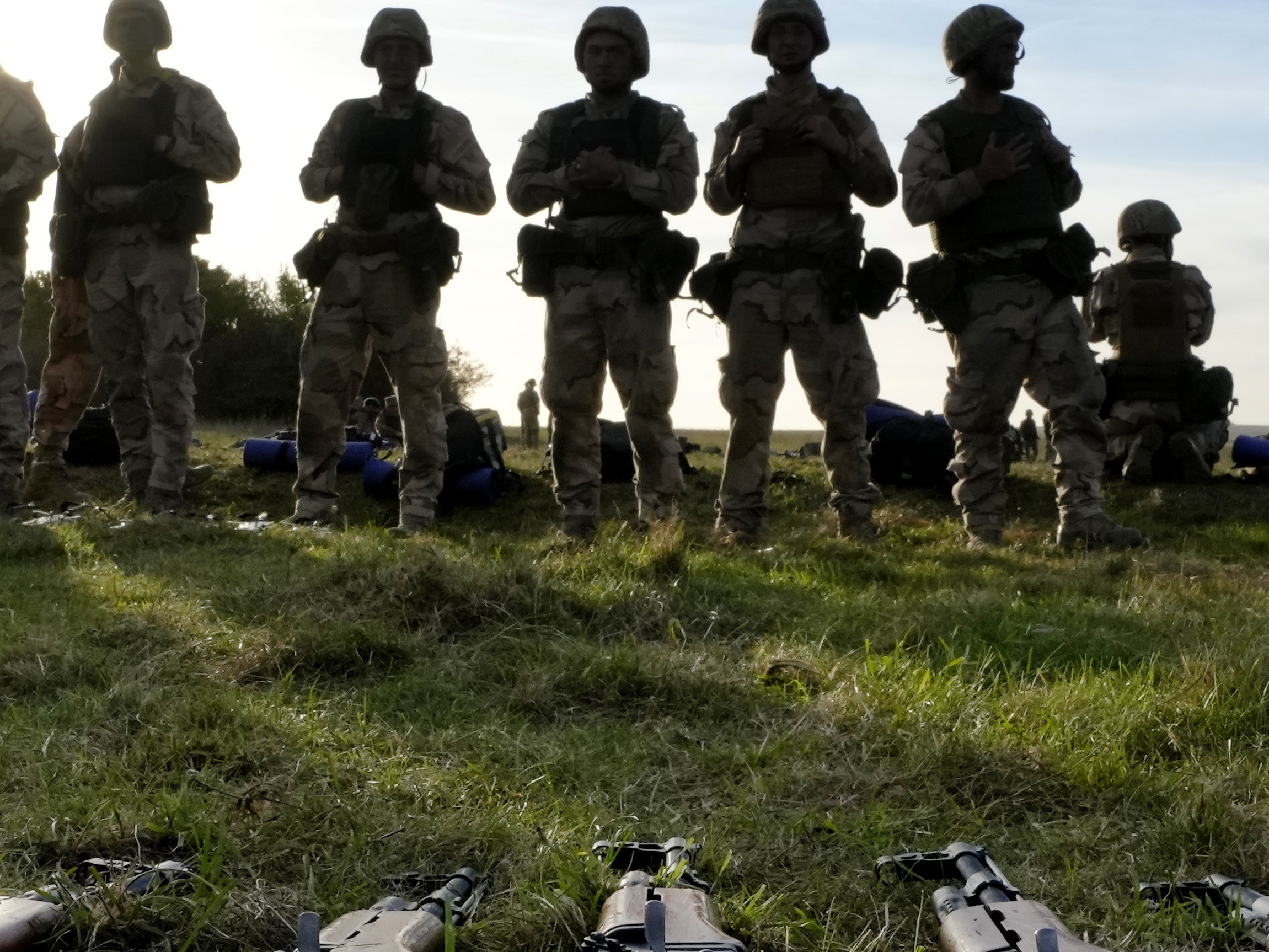 caption: FILE - Weapons lie on the ground as Ukrainian personnel train at a base in Southern England. The U.S. military's new, expanded combat training of Ukrainian forces began in Germany on Sunday, Jan. 15th.