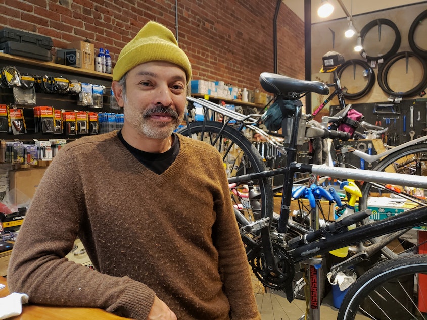 caption: Ben Rainbow says in nearly eight years he's "seen a lot" in the alley where his bike repair shop is. Rainbow said it takes time away from his business on Monday, October 22, 2019.