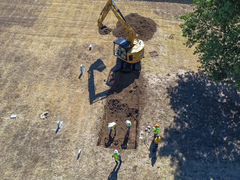 caption: Scientists at the site in Tulsa, Okla., will begin excavating by hand, using finer grain tools to clean up the coffins. That will help researchers analyze the construction style and hardware of the caskets in order to determine when they were interred.