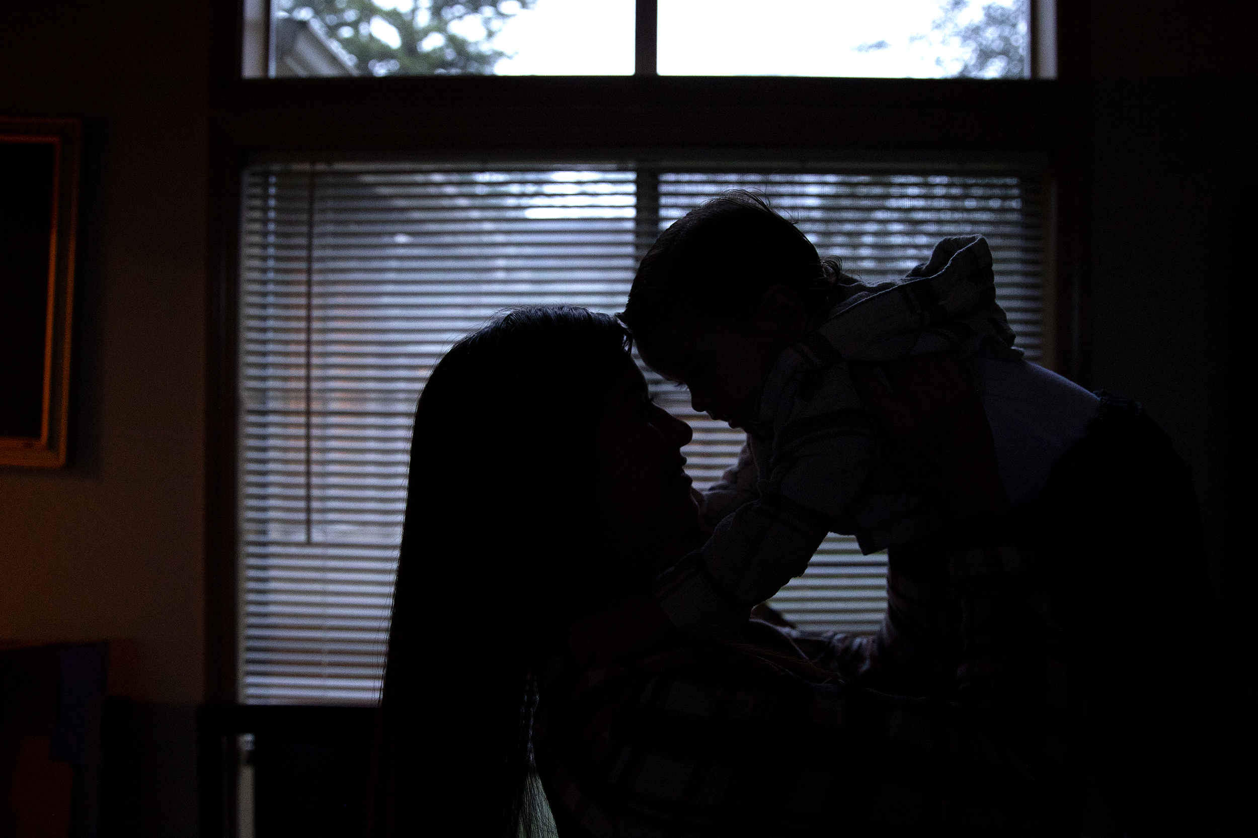 caption: Mariah is portrayed holding her son on Friday, November 21, 2025, at her home in Renton. 