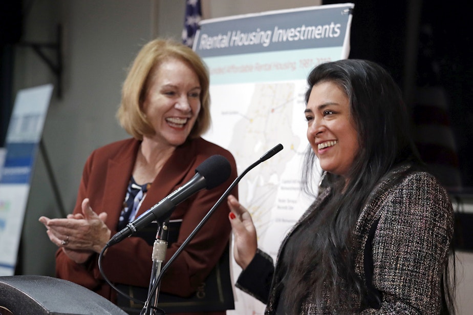 caption: In this Monday, Dec. 17, 2018, photo, Colleen Echohawk, right, executive director of Chief Seattle Club, is applauded by Mayor Jenny Durkan as Echohawk speaks during a news conference announcing that Seattle will invest more than $75 million on affordable-housing units in the next year. Durkan says the investment puts the city on target to make available nearly 4,000 new homes by 2022.
