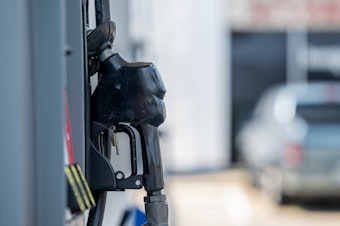 caption: A gas pump is seen at a Chevron gas station on June 9 in Houston, Texas. Gas prices nationally hit an average of $5 a gallon, according to AAA.