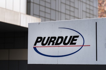 caption: A sign for Purdue Pharma stands outside the OxyContin manufacturer's headquarters earlier this year in Stamford, Conn.