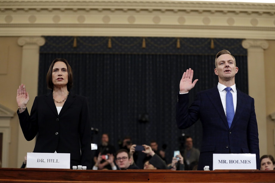 caption: Former White House national security aide Fiona Hill, left, and David Holmes, a U.S. diplomat in Ukraine, are sworn in to testify before the House Intelligence Committee on Capitol Hill in Washington, Thursday, Nov. 21, 2019, during a public impeachment hearing of President Donald Trump's efforts to tie U.S. aid for Ukraine to investigations of his political opponents. 