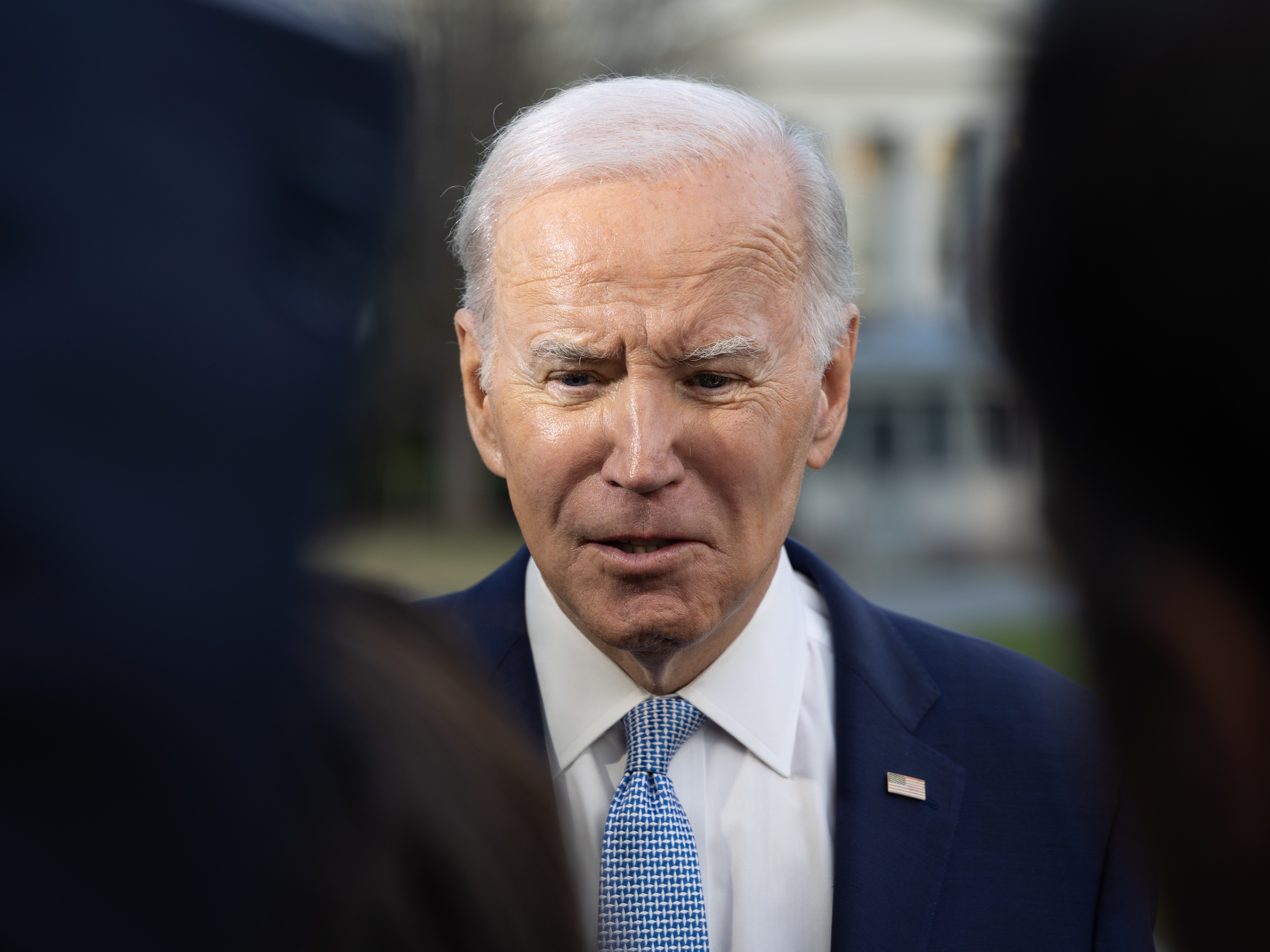 caption: President Biden speaks to reporters at the White House on Feb. 24, 2023.