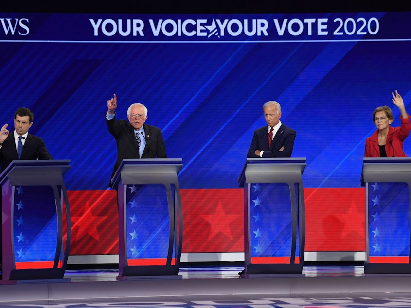 caption: In Houston on Thursday, Democratic presidential hopefuls Mayor Pete Buttigieg, Sen. Bernie Sanders, former Vice President Joe Biden and Sen. Elizabeth Warren participate in the third Democratic primary debate of the 2020 presidential campaign season.