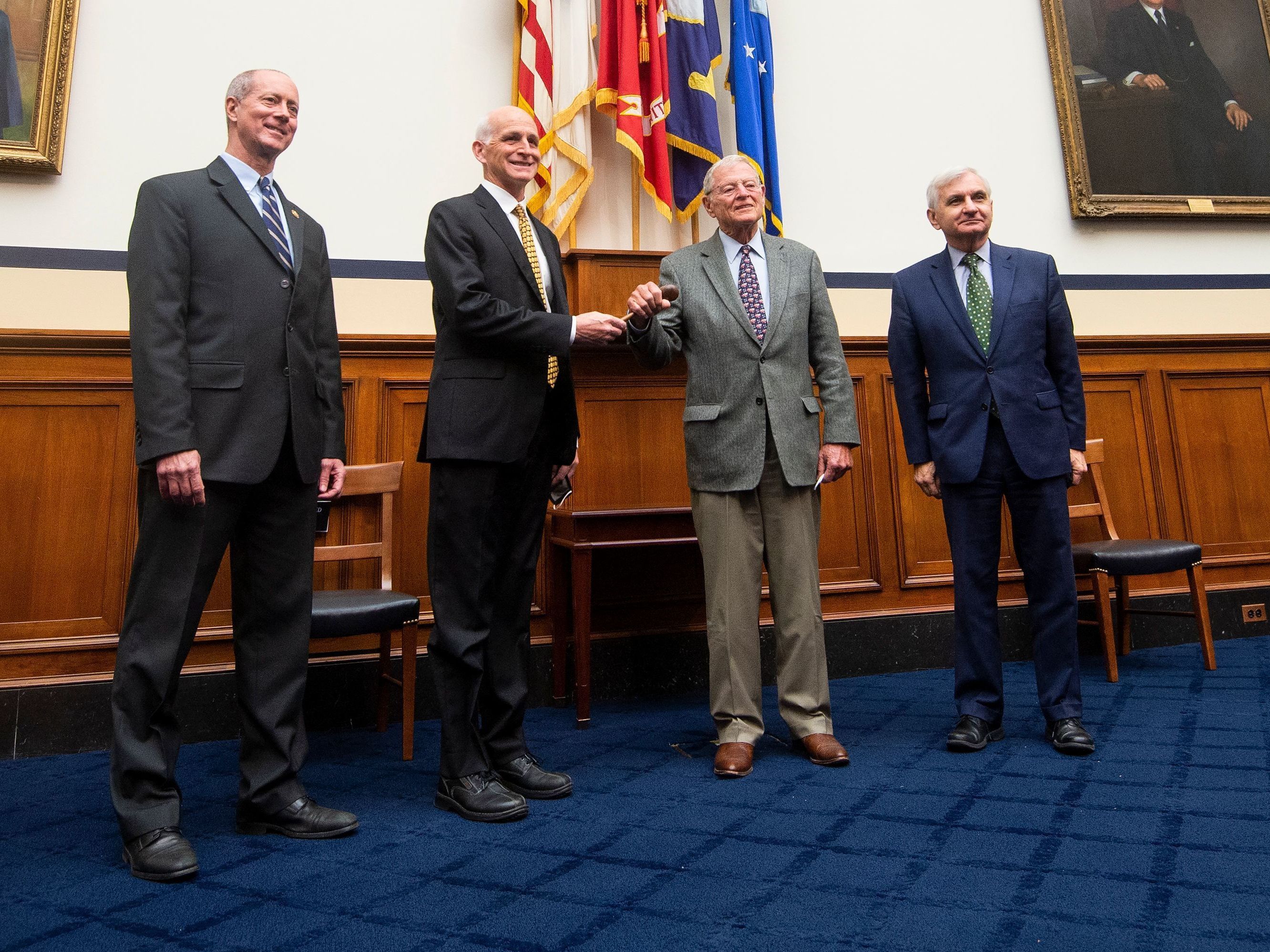 caption: Leaders of the House and Senate Armed Services Committees Congressman Adam Smith and Senator James Inhofe participate in a ceremonial gavel passing on Nov. 18, 2020 in Washington, DC.