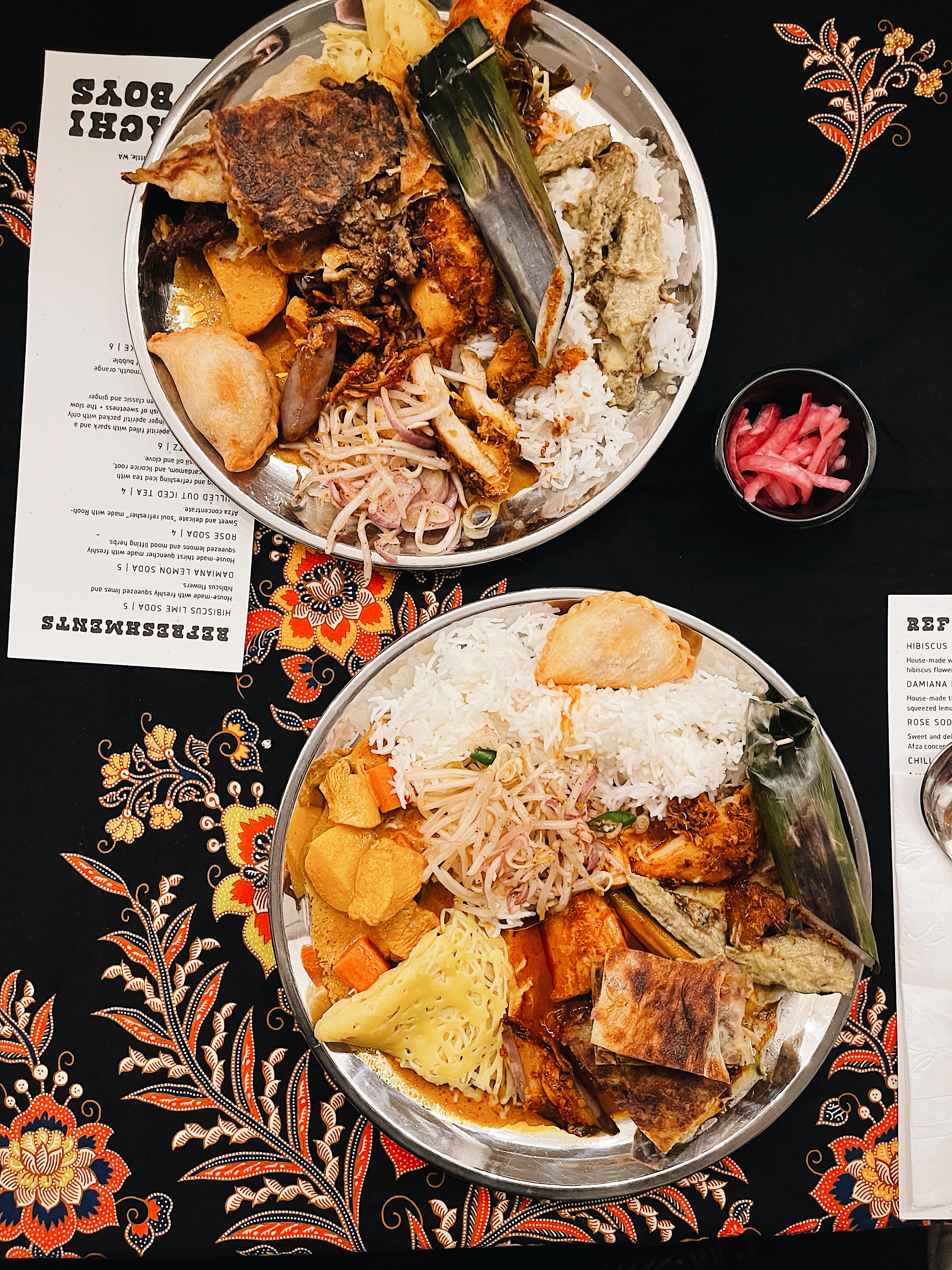 caption: A delicious and generous portion of Malay cuisine at a sit-down dinner. This is Emily Kim's favorite way to experience the pop-up.