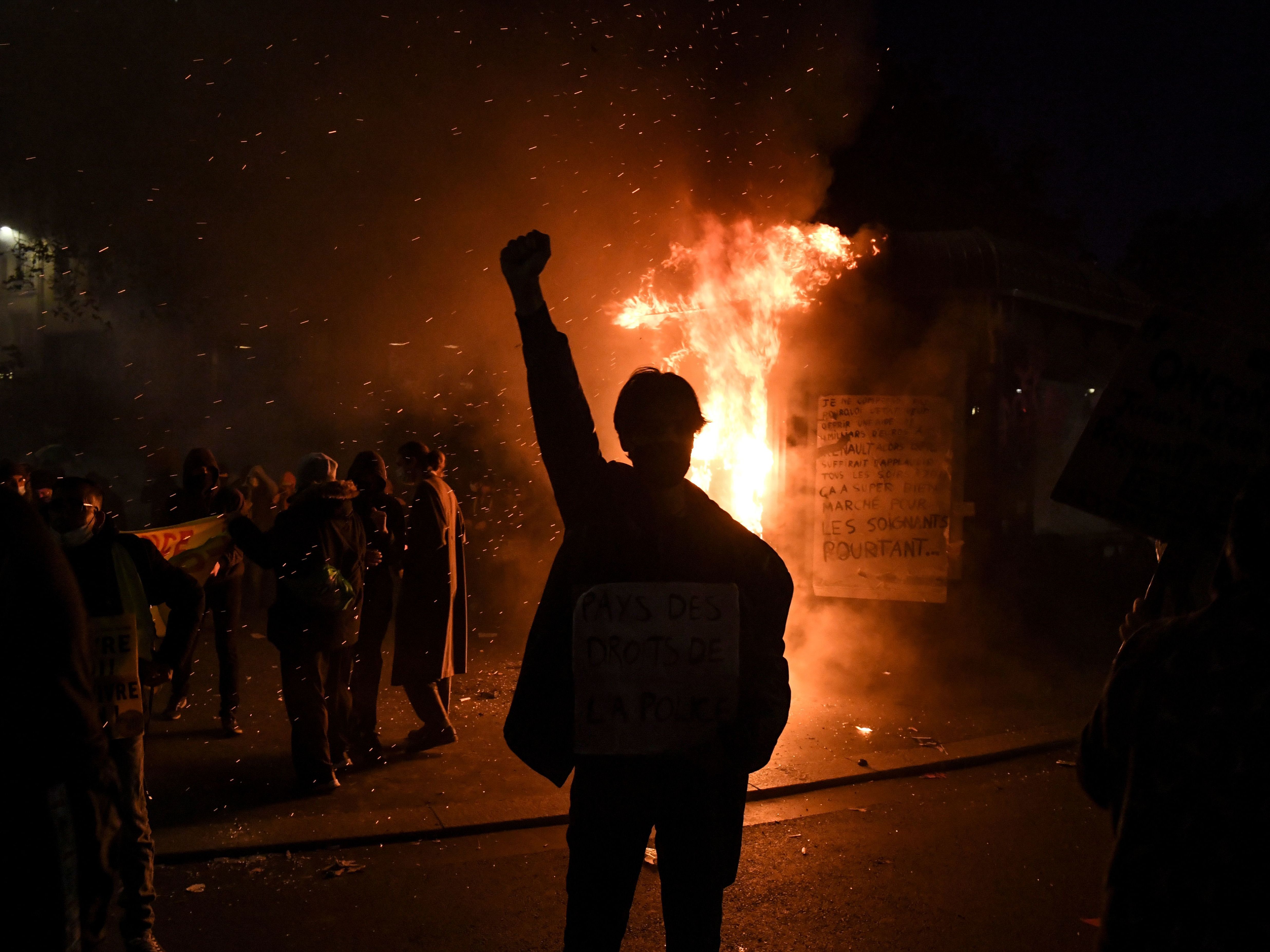 caption: Thousands of protesters across France hit the streets Saturday to condemn police brutality and a proposed law that would make it harder to publicize images of on-duty police officers.
