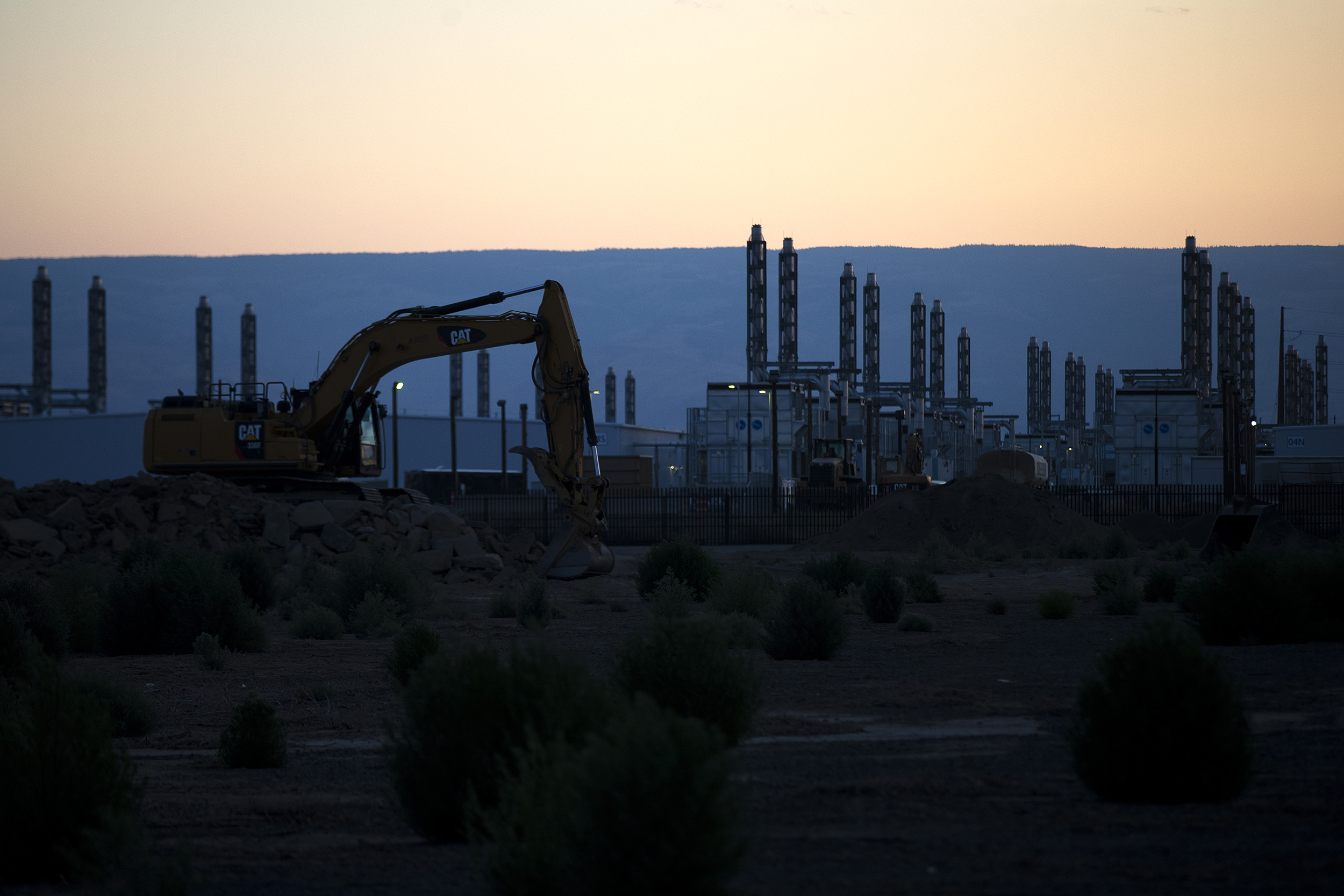 caption: Construction continues on a Microsoft data center on Thursday, July 17, 2025, in Quincy, Washington. Fueled by hundreds of billions in capital expenditures and enthusiasm from the Trump administration, the data center bonanza offers a tempting promise: that small towns could find a new industrial anchor, bringing good jobs, tax revenue, and prosperity to swaths of the country that have been left behind by the digital revolution. But there's a cost. 