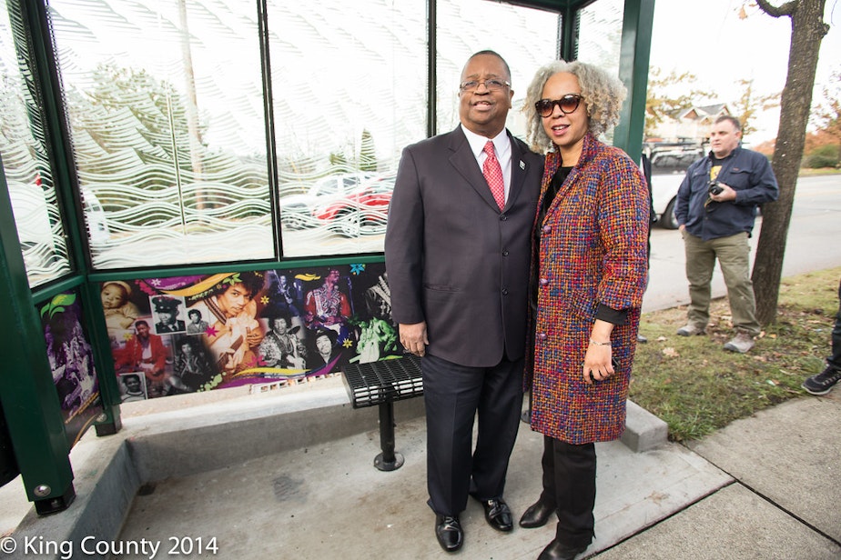 caption: King County Councilmember Larry Gossett at a Jimi Hendrix bus stop. This photo was posted to Flickr in 2014.
