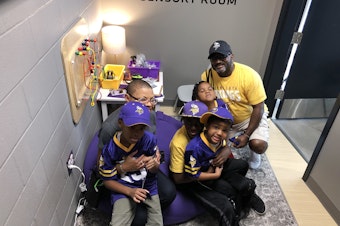 caption: Sheletta and Shawn Brundidge, alongside their four children, were the first fans to use the sensory room at the Minnesota Vikings' U.S. Bank Stadium. Opened during the August pre-season, the space comes with trained therapists and provides fans, including those with autism, a break from the excitement of the game.