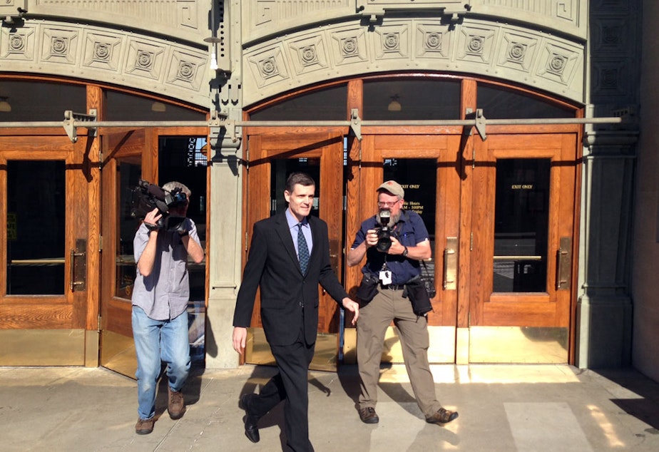 caption: Former WA State Auditor Troy Kelley leaves court during his first trial which ended in 2016 with the jury deadlocking on most charges and acquitting him of one. Kelley was later retried and convicted on several counts. On July 7, 2021, he reported to prison. 