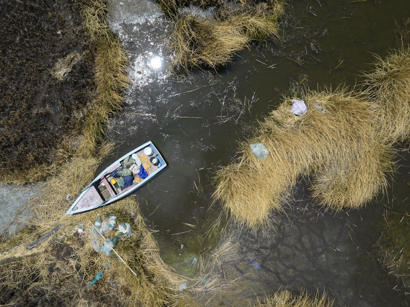 caption: An aerial view of a stuck boat on a dried out lake in Bolivia. A new report finds that September 2023 was the hottest September on record. South America - which is coming out of its winter - also saw record high temperatures.