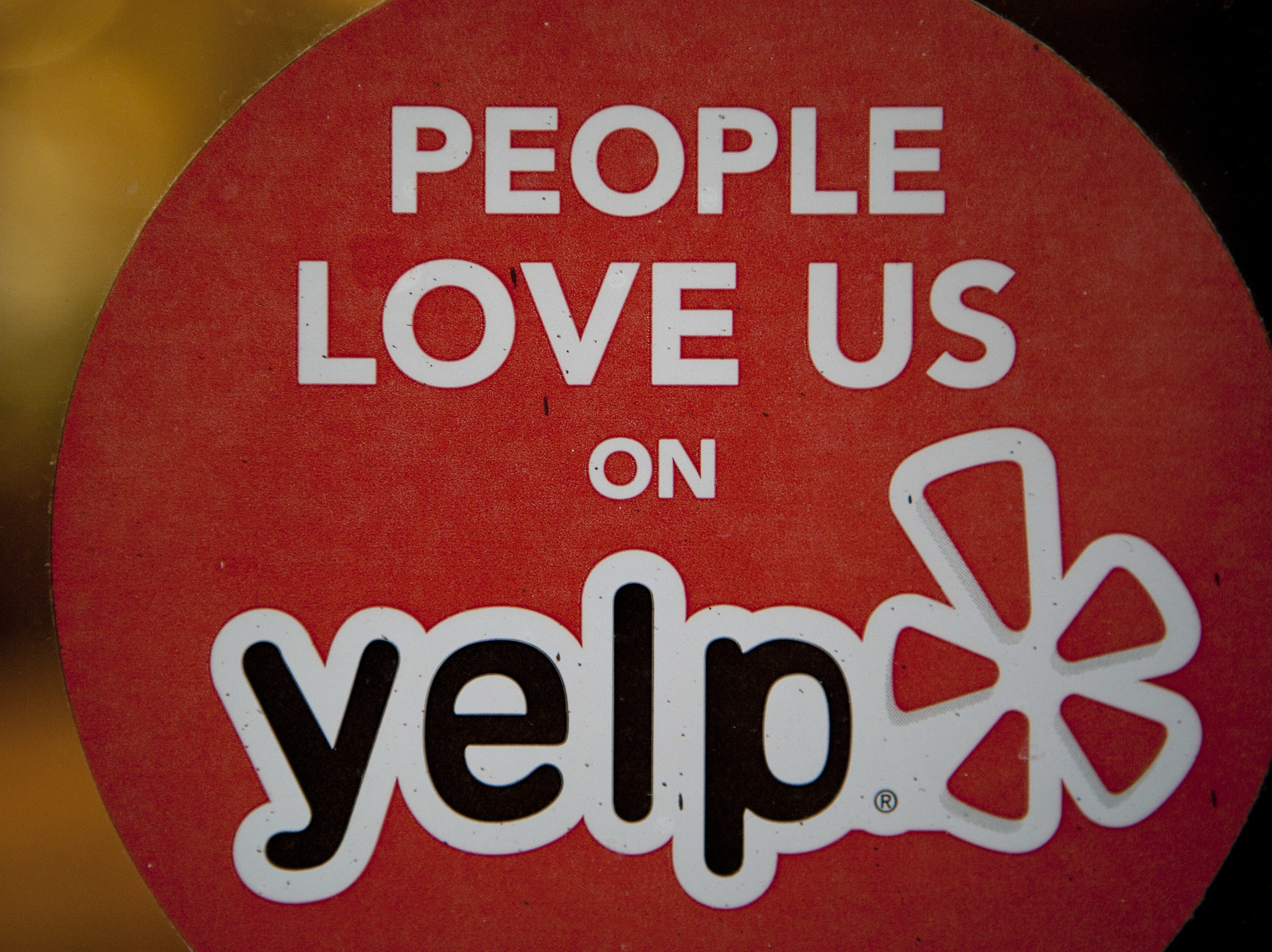 caption: Yelp announced a new initiative on Thursday to label businesses that users have reported for racist behavior.