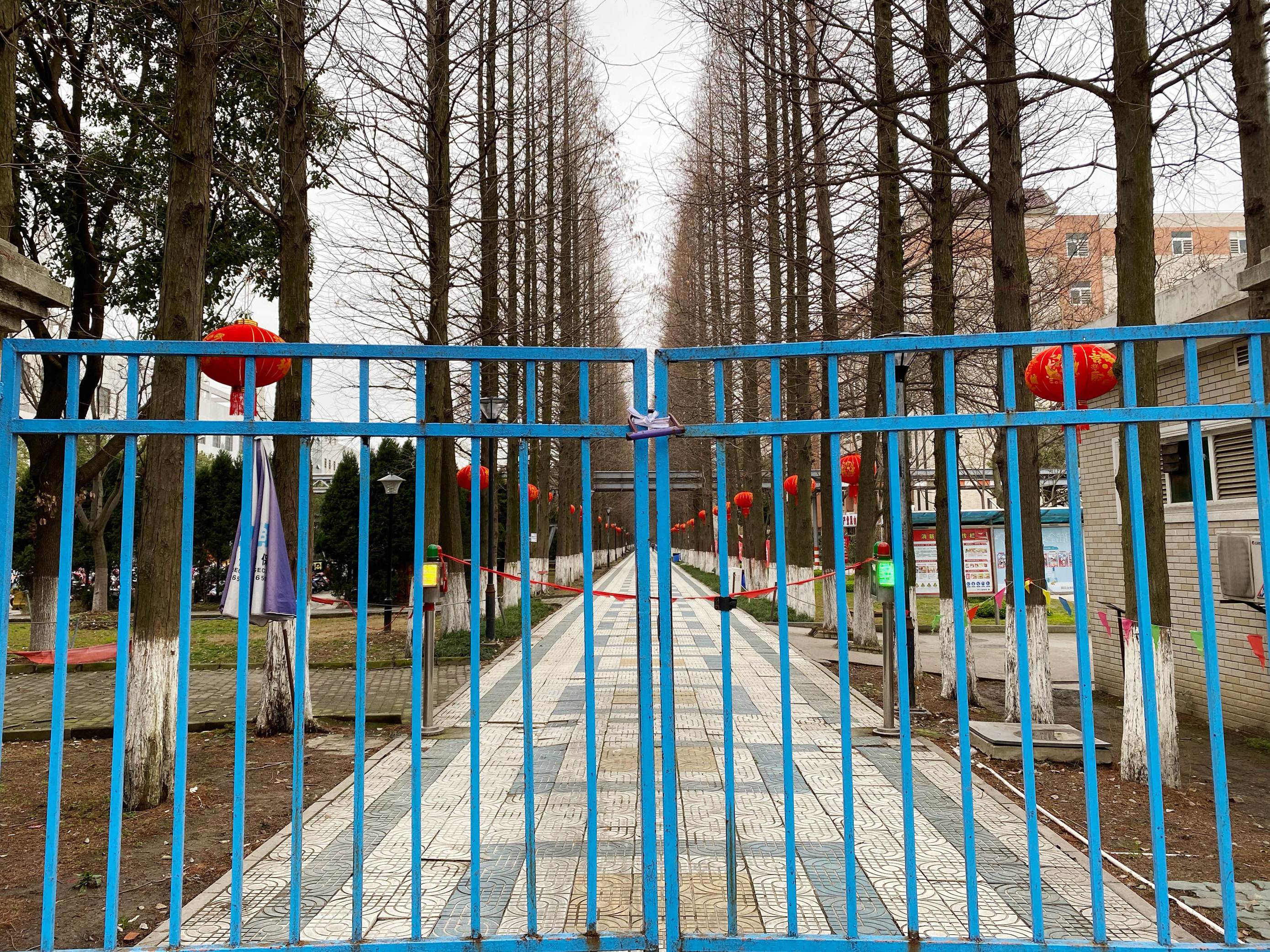 caption: An entrance to a dormitory for Foxconn workers. China's factories normally ramp up production right after the Lunar New Year, but few workers have returned so far this year.