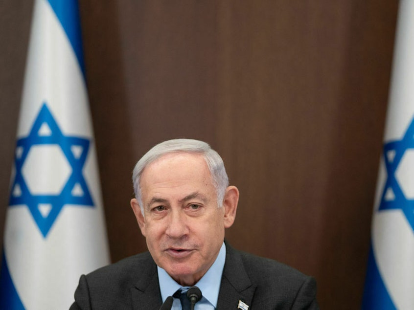 caption: Israel's Prime Minister Benjamin Netanyahu is pictured at his office in Jerusalem on Monday. Netanyahu spoke with President Biden, who invited him for a meeting later this year.