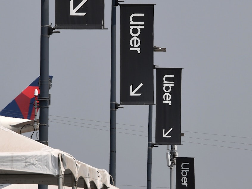 caption: Uber and Lyft have been fighting a California labor law that would require them to treat drivers as employees rather than independent contractors.