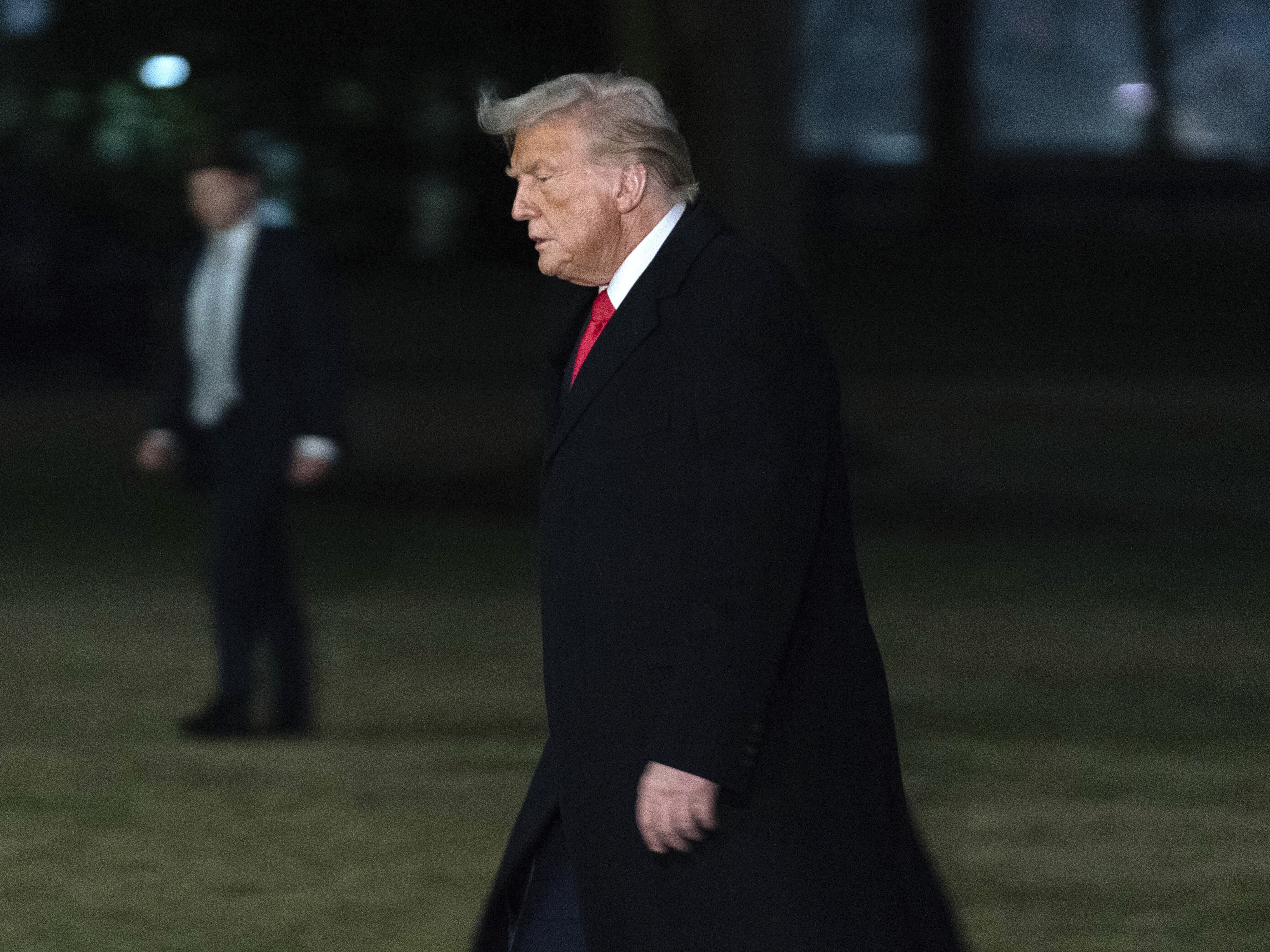 caption: President Trump arrives back at the White House after visiting New Orleans to attend the Super Bowl. A federal judge on Monday found that the administration has not fully followed his order to unfreeze federal spending.