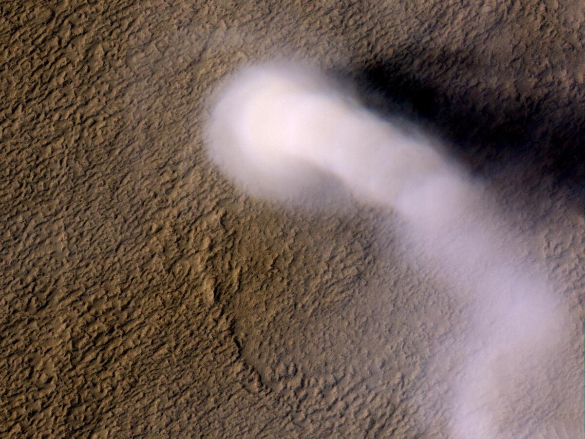 caption: On Earth, lightning can occur in turbulent clouds of volcanic ash. Now researchers have found evidence of sparks in Martian dust devils.