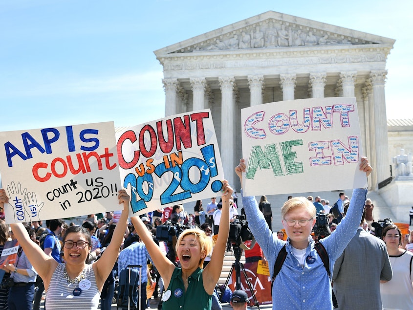 caption: Demonstrators rally outside the U.S. Supreme Court in Washington, D.C., in April to protest the Trump administration's plan to add a citizenship question to forms for the 2020 census.