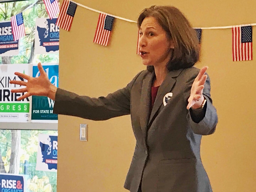 caption: Democrat Kim Schrier speaks to supporters at a community center in Federal Way on Thursday.
