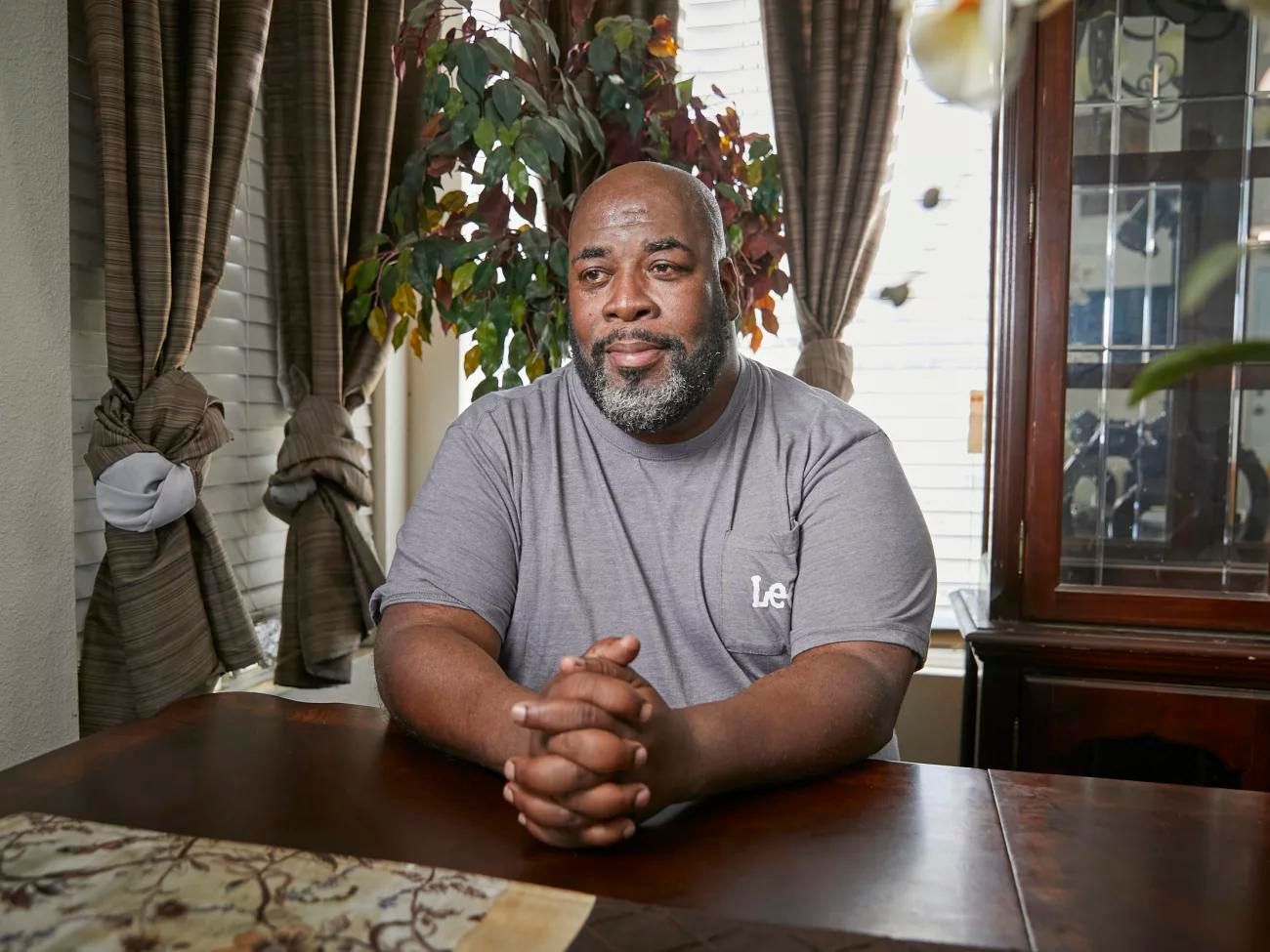 caption: Wymon Johnson, poses for a portrait at his residence in Bakersfield, Calif. Johnson is currently renting a room from a friend while he is waiting for long term housing through the Kern County Housing Authority.
