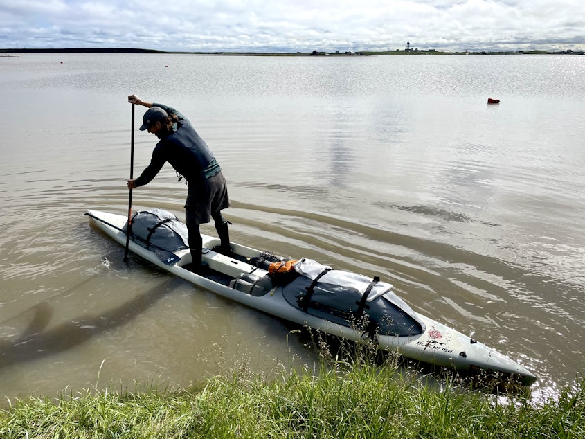 caption: Adventurer Karl Kruger set out from Tuktoyaktuk, Canada, on July 24 to conquer the Northwest Passage with an estimated 150 pounds of food and gear strapped to his paddleboard.