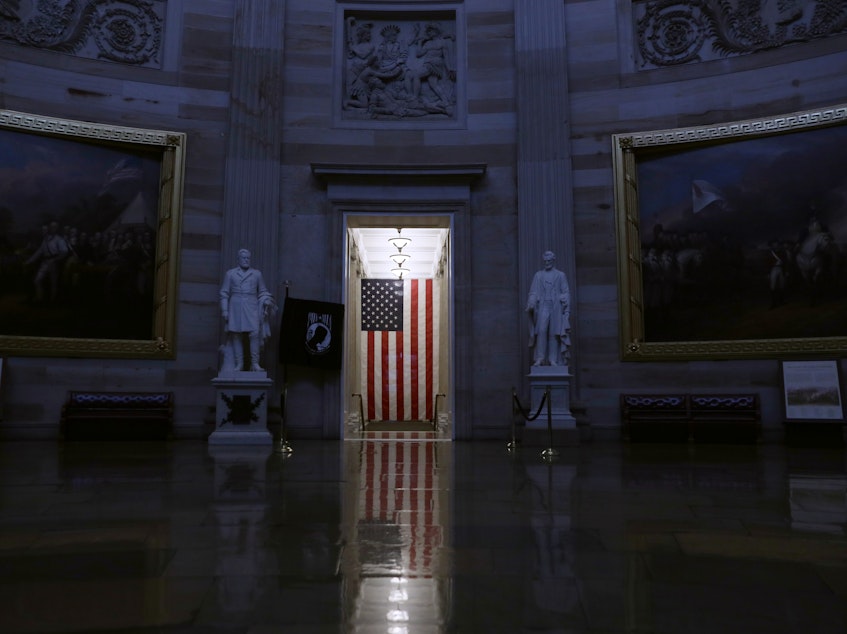 caption: The White House Office of Management and Budget issued new guidance Saturday telling federal workers that "only mission-critical travel is recommended at this time." Above, the rotunda at the U.S. Capitol stands empty after the visitor center suspended all public tours amid the coronavirus outbreak.