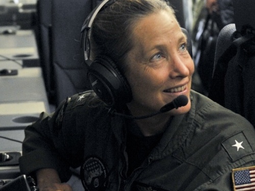 caption: Rear Adm. Shoshana Chatfield sits at a mission crew work station in Guam. Chatfield has been named the next president of the Naval War College.