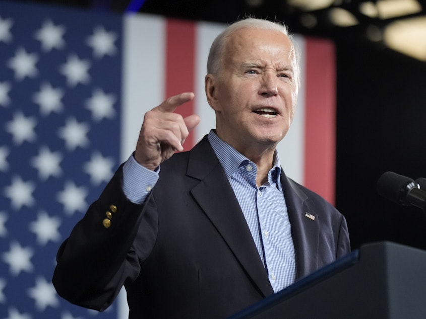 caption: President Joe Biden speaks at a campaign rally March 9 at Pullman Yards in Atlanta.