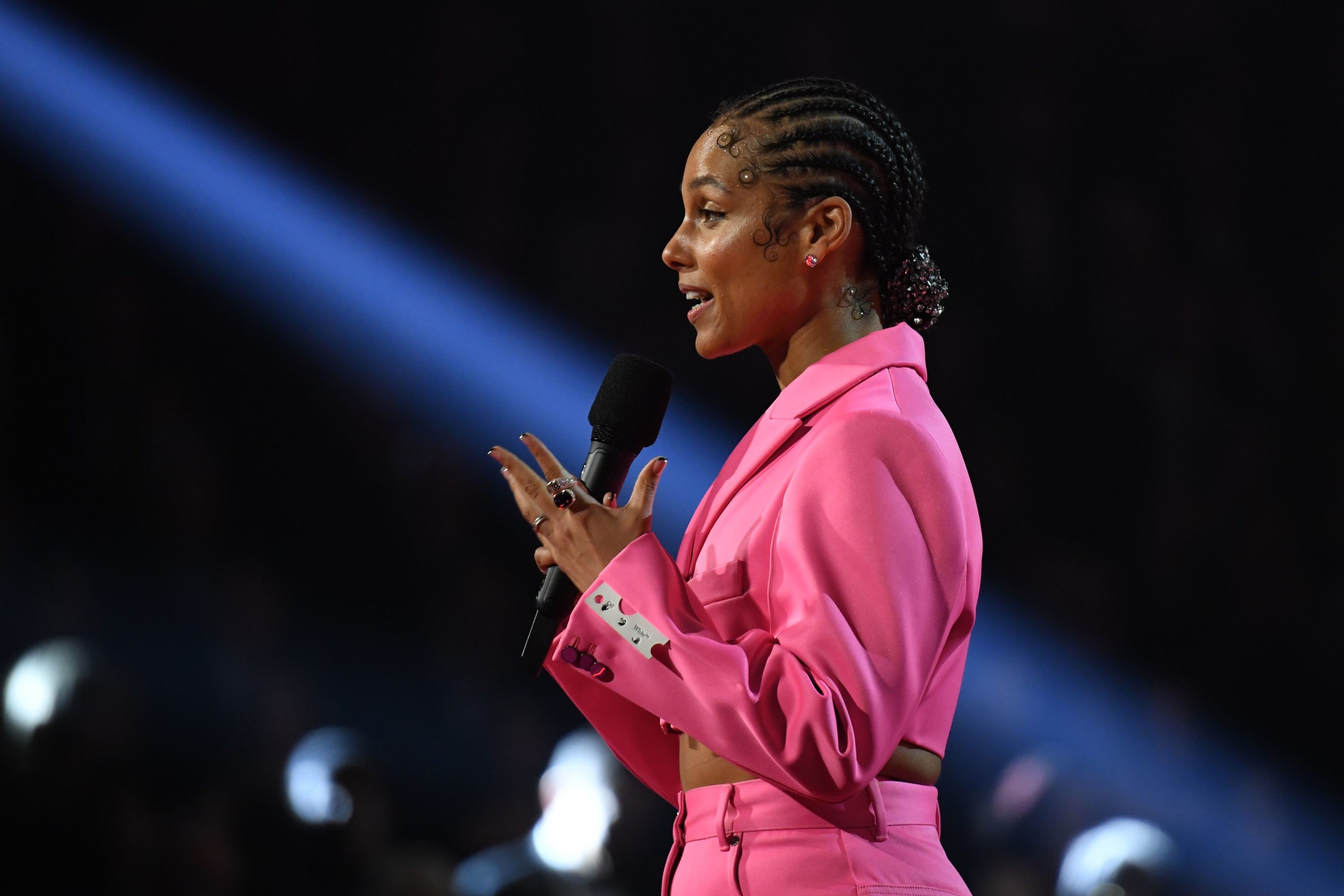 caption: Singer-songwriter Alicia Keys speaks during the 62nd Annual Grammy Awards on January 26, 2020, in Los Angeles. (ROBYN BECK/AFP via Getty Images)