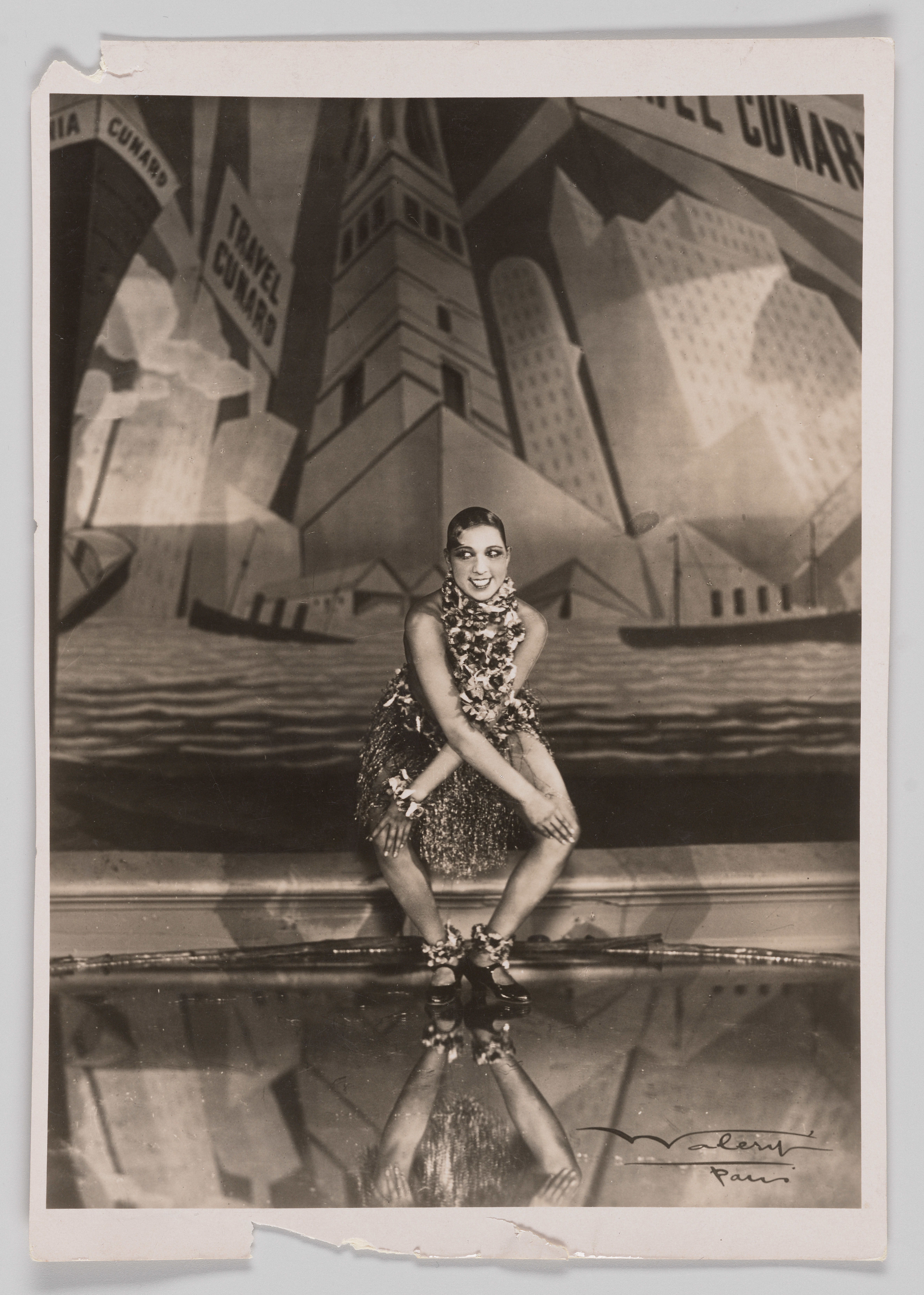 caption: Josephine Baker performs the Charleston onstage at Folies Bergère, circa 1926-1935.