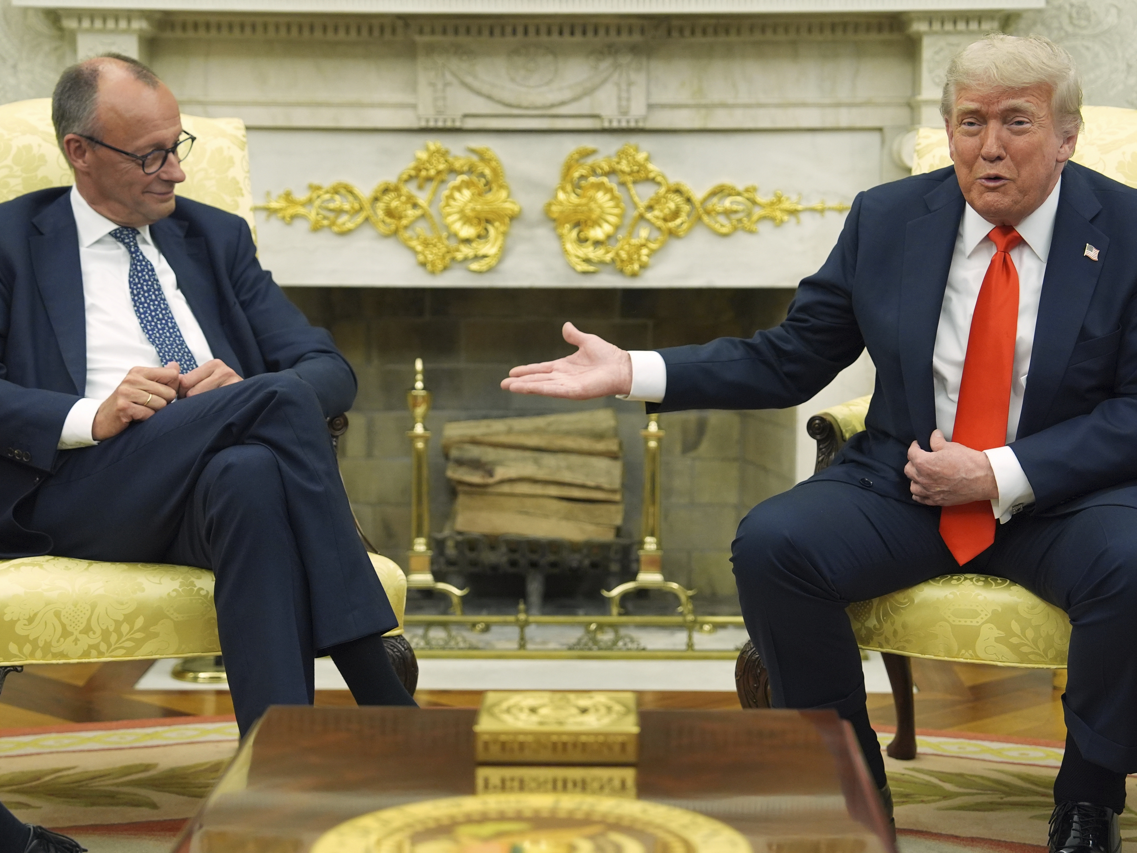 caption: President Donald Trump, right, meets Germany's Chancellor Friedrich Merz in the Oval Office of the White House on Thursday.
