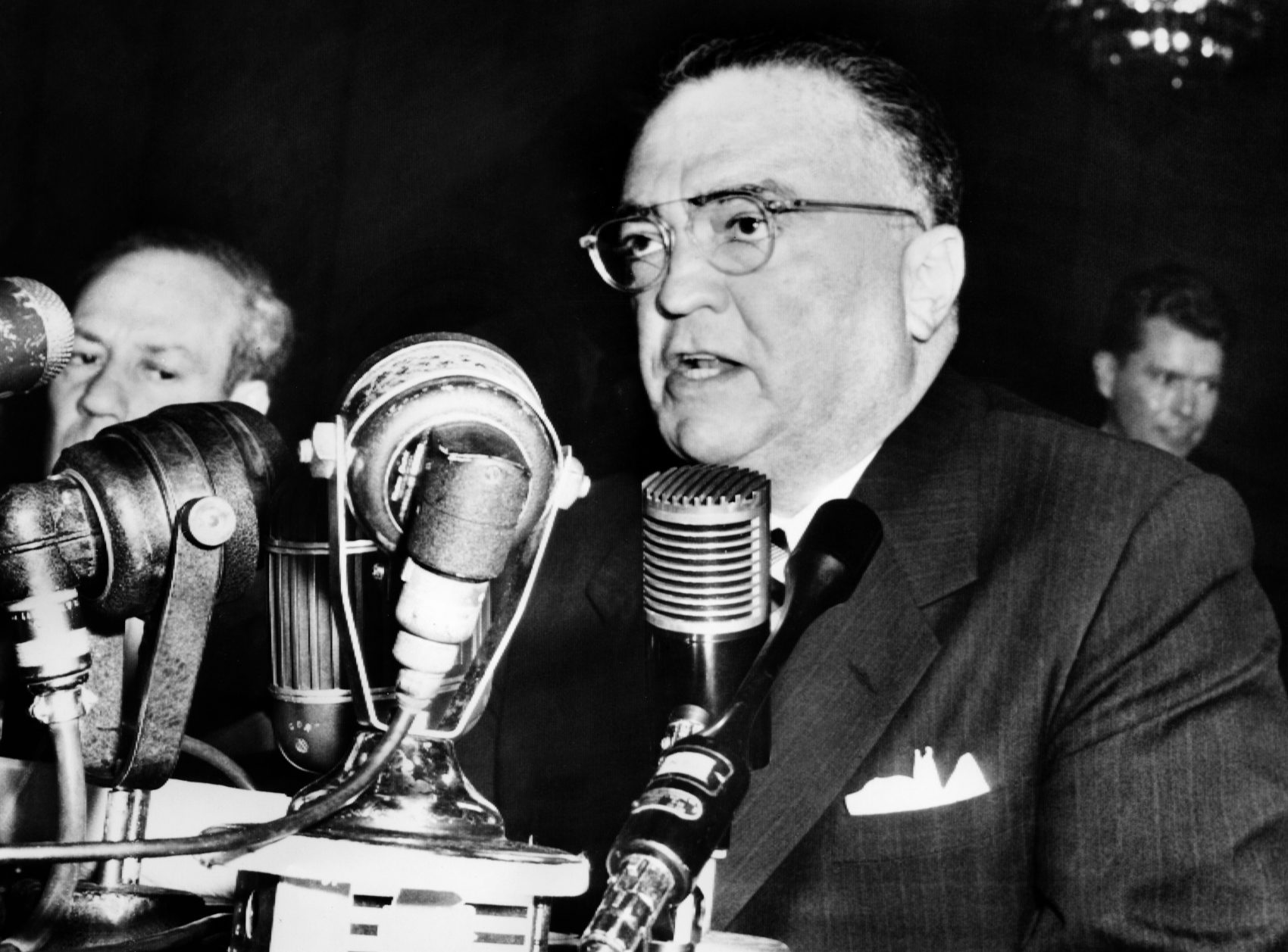caption: J. Edgar Hoover, director of the Federal Bureau of Investigation, gives a speech during testimony before a Senate committee in 1953 in Washington, D.C. (Bob Mulligan/AFP/Getty Images)