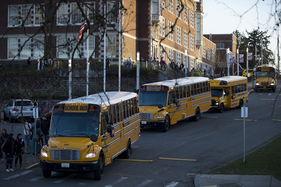 caption: School busses line up at the end of the school day on Monday, January 7, 2019, at Garfield High School in Seattle. 