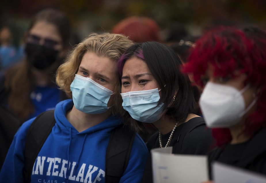 caption: Interlake High School senior Sam Mahlman, left, and junior Mia Tsai, comfort each other as fellow classmates share their experiences with sexual assault and rape during a protest in response to the school administration's handling of sexual assault cases, on Tuesday, November 23, 2021, at Interlake High School in Bellevue. 
