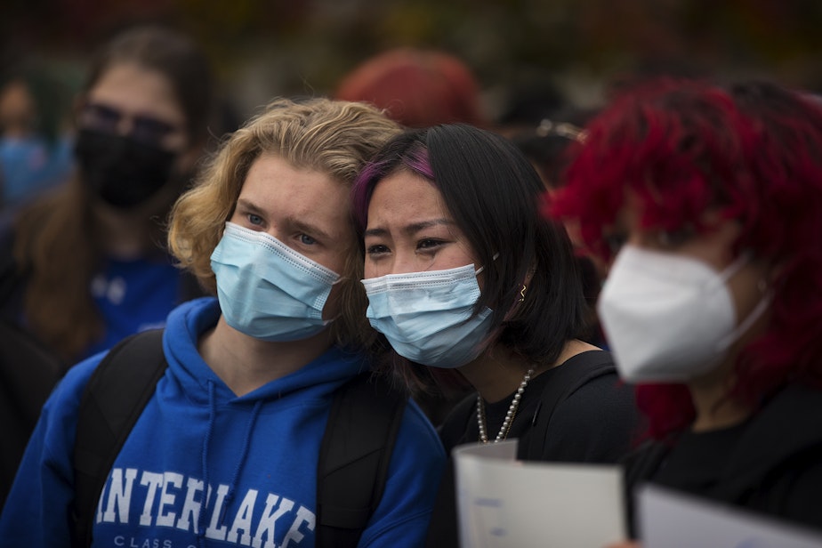 caption: Interlake High School senior Sam Mahlman, left, and junior Mia Tsai, comfort each other as fellow classmates share their experiences with sexual assault and rape during a protest in response to the school administration's handling of sexual assault cases, on Tuesday, November 23, 2021, at Interlake High School in Bellevue. 