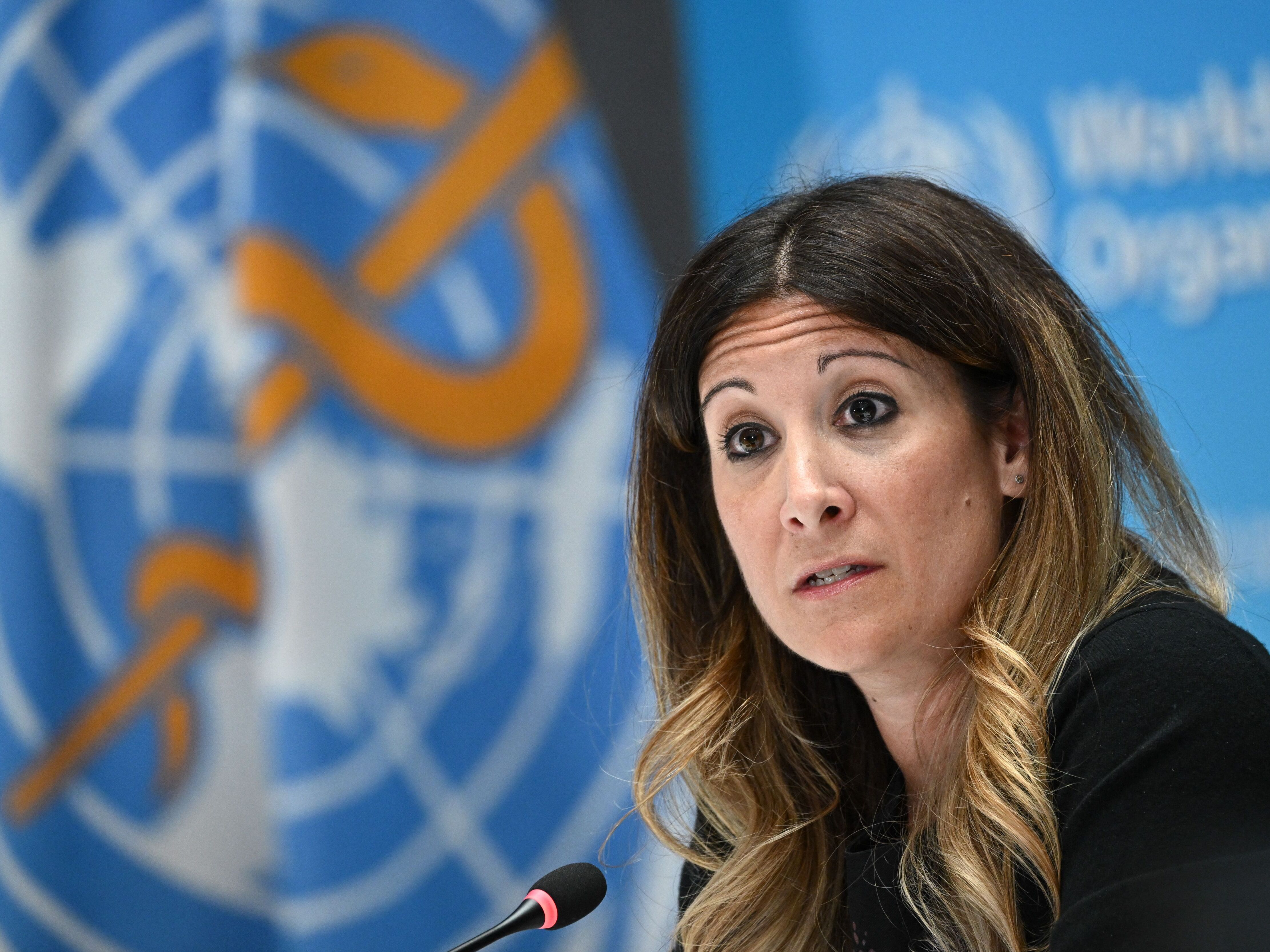 caption: Maria Van Kerkhove speaks at a World Health Organization press conference. The public face of WHO at over 250 briefings on COVID, she says she and her colleagues are now scrambling to respond to the "abrupt" halt in most U.S. foreign aid.