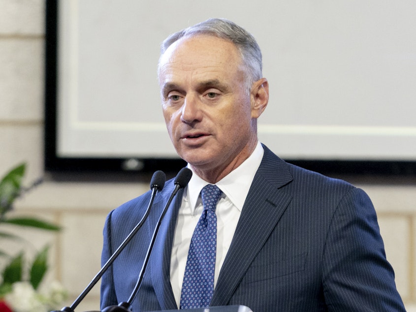 caption: Major League Baseball Commissioner Rob Manfred, pictured in January, on Friday said the organization unwaveringly supports "fair access to voting."