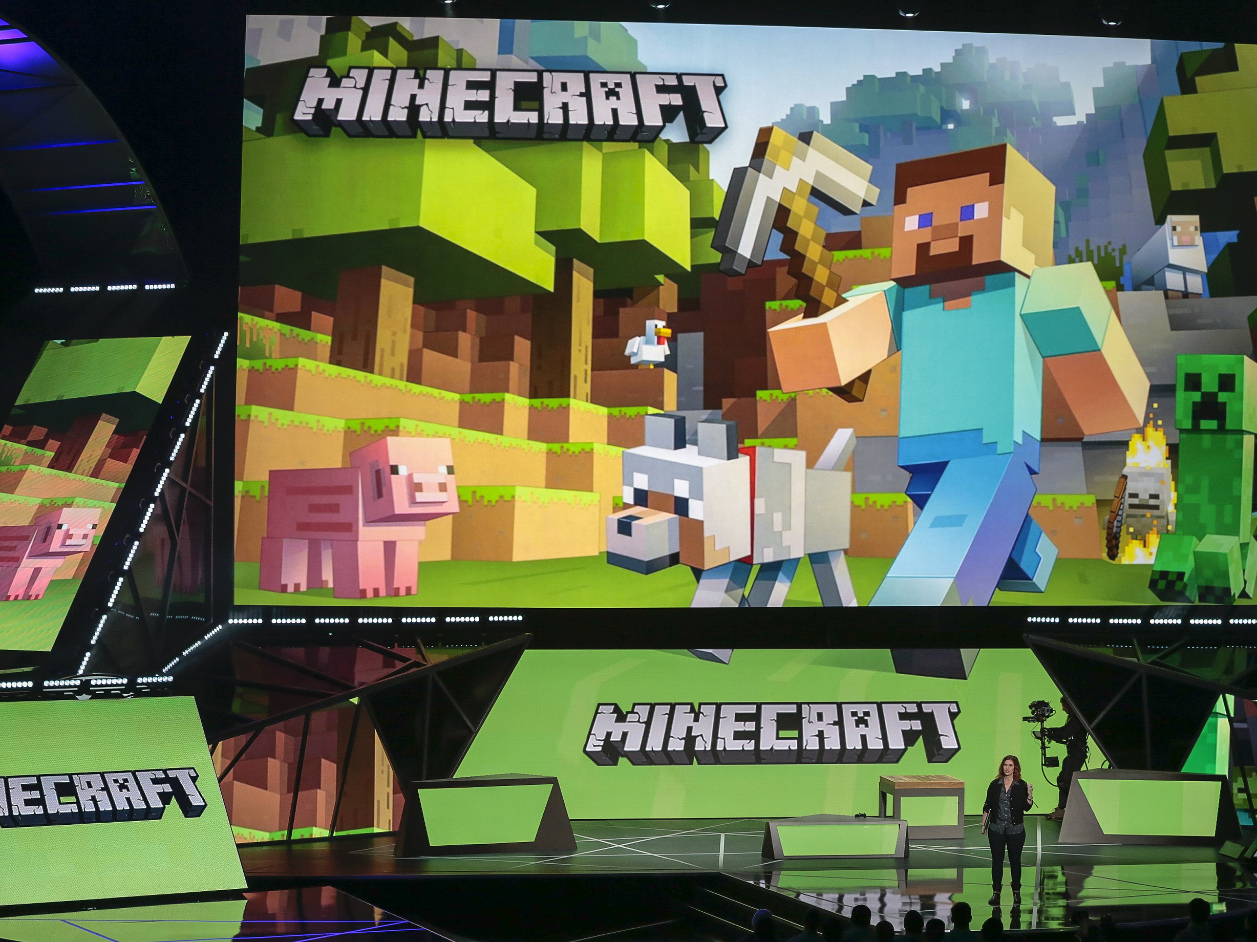 caption: Lydia Winters shows off Microsoft's "Minecraft" ahead of the Electronic Entertainment Expo, in 2015. Cybersecurity experts say Minecraft players were quick to exploit a critical flaw in widely used software that intelligence firms raced to patch Friday.