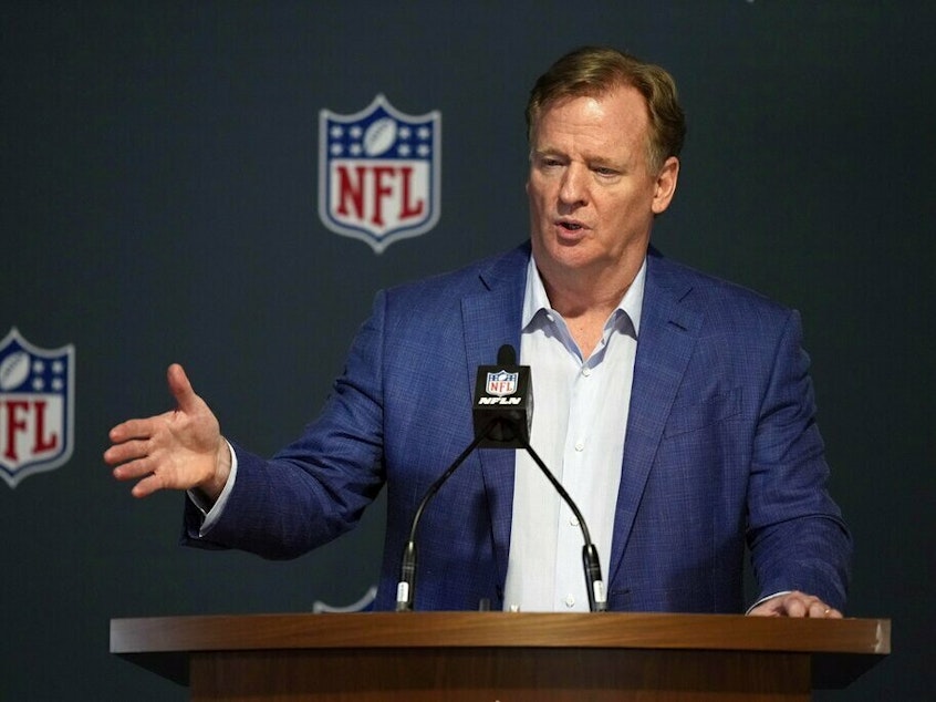 caption: NFL Commissioner Roger Goodell answers questions from reporters at a March 29 press conference following the close of the NFL owner's meeting at The Breakers resort in Palm Beach, Fla.