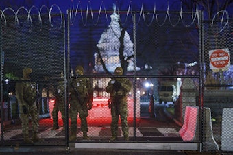 caption: National Guard troops reinforce the security zone on Capitol Hill in Washington early Tuesday, before President-elect Joe Biden is sworn in as the 46th president on Wednesday.