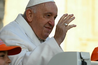 caption: Pope Francis.