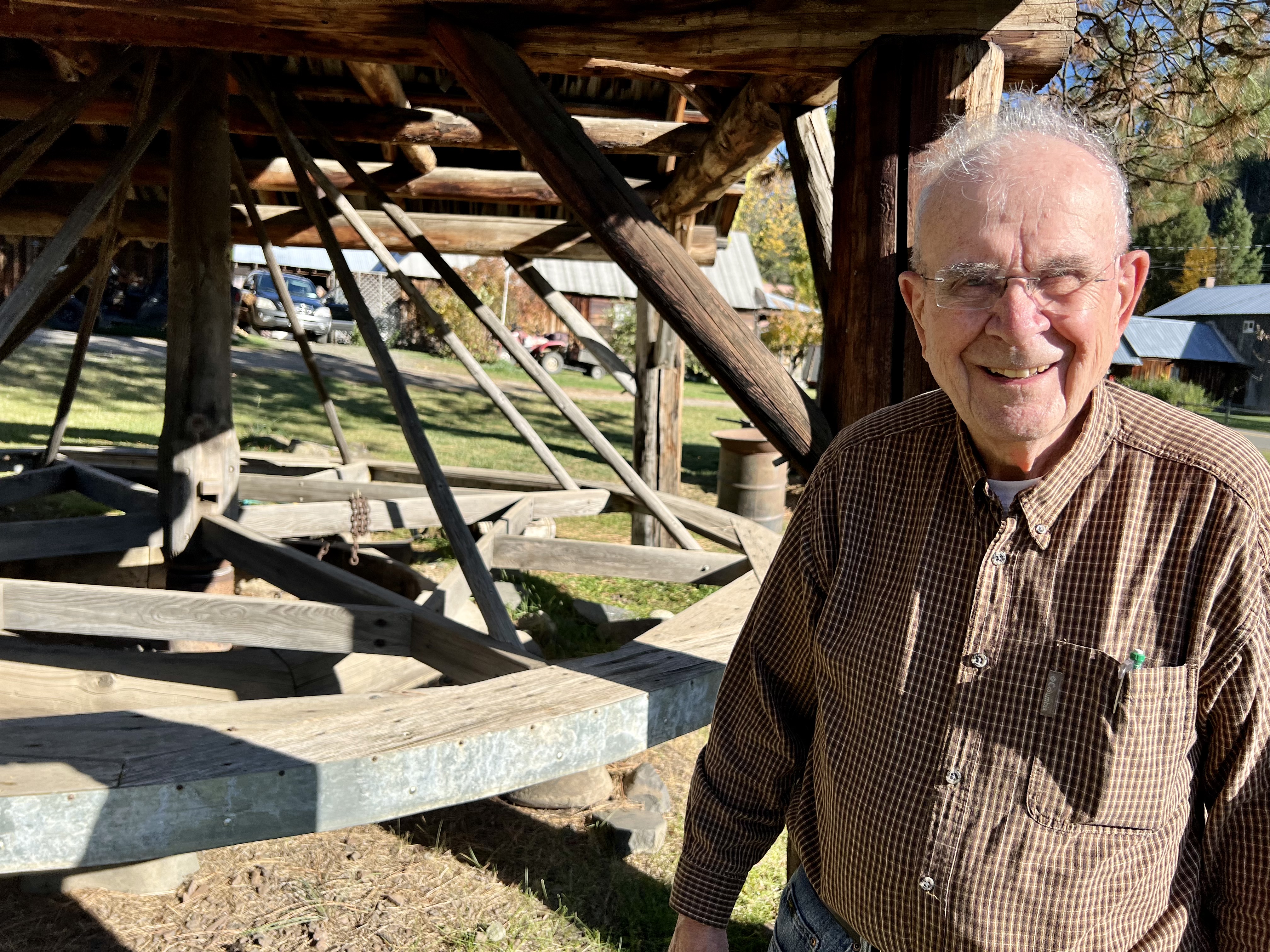 caption:  Wes Engstrom, 91, first came to Liberty, Wash., in 1971 in search of gold. He's standing in front of the town's oldest working mining equipment called an arrastra.